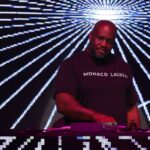 What Is Indo House Music? 7 Powerful Ways This Global Fusion Sound Is Changing the World 2 Monaco Lauren performing an Indo House DJ set, blending Indian instruments and electronic beats to embody what is Indo House music—a global fusion of culture and rhythm.